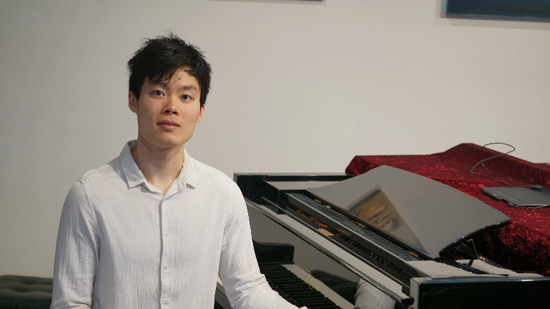 Hanford Lam seated at a piano